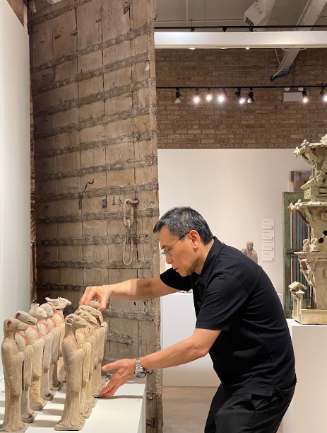 A man adjusting figures in the display